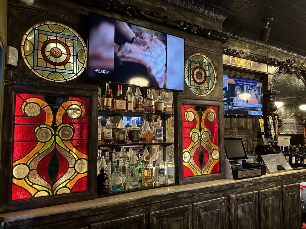 intracate stained glass bar back at The Mouse Trap Bar at Cocoa Beach Fish Camp Grill