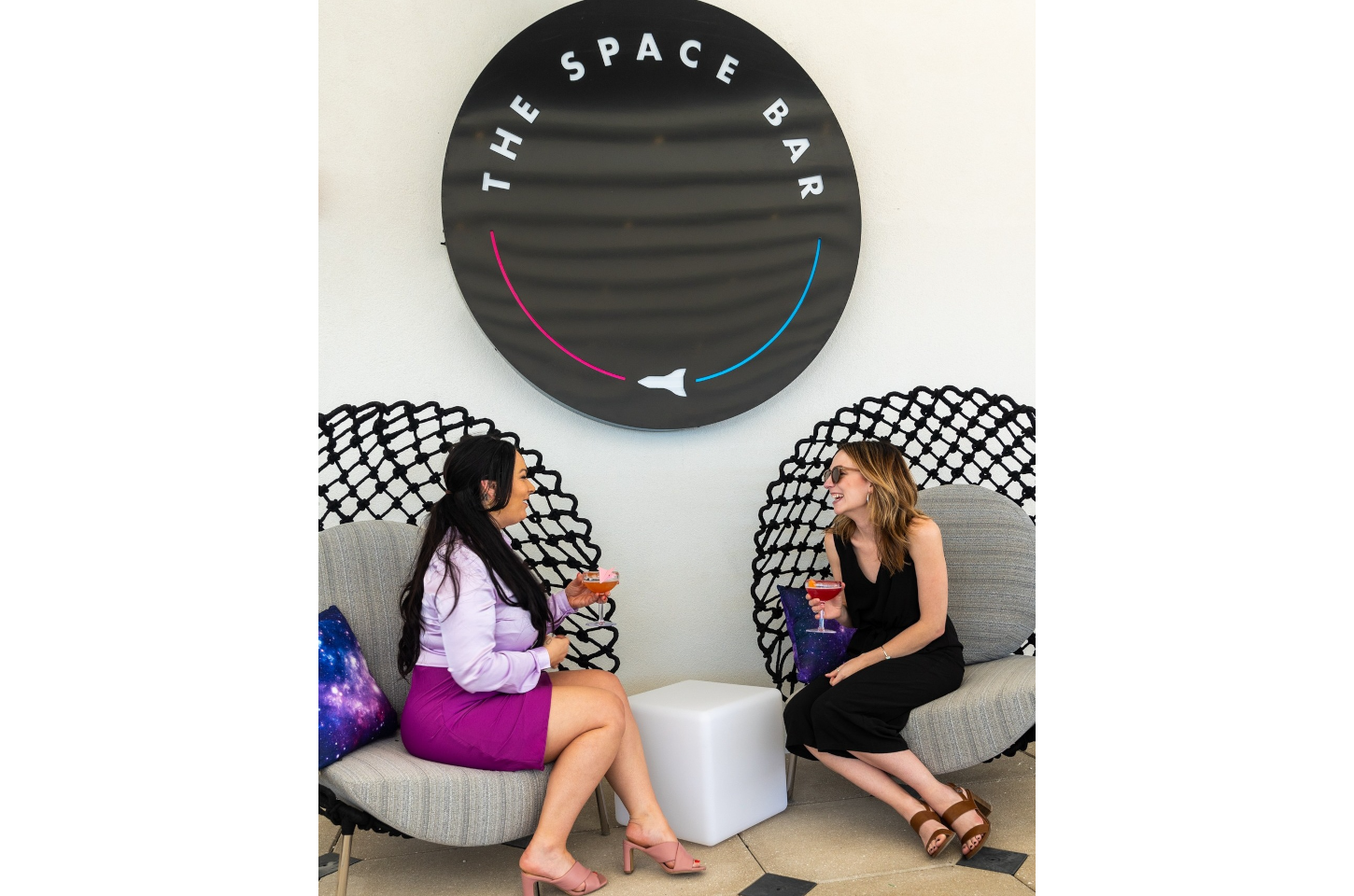 Women have cocktails at The Space Bar in Titusville