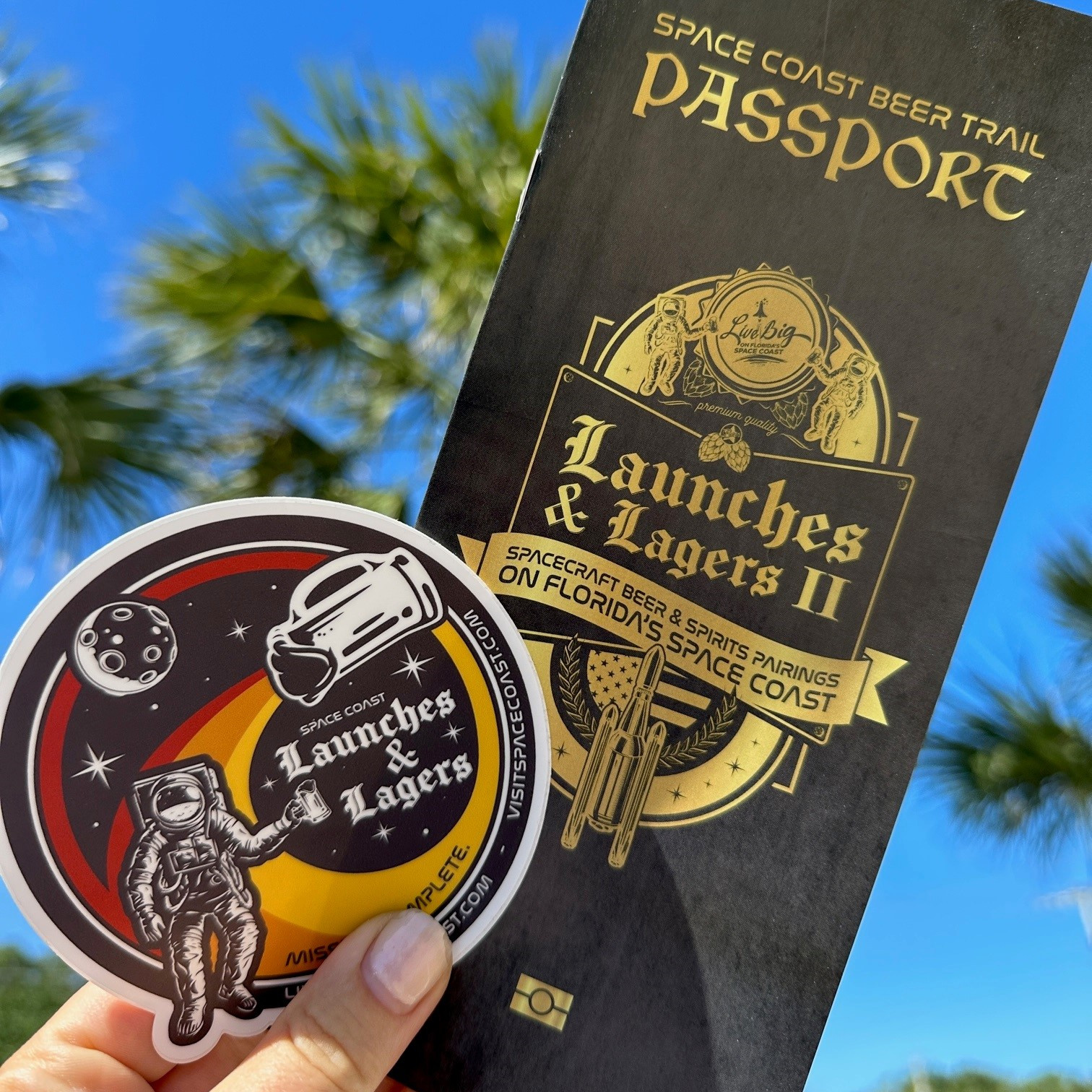 hand holds launches and lagers passport and patch